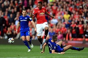 Images Dated 17th September 2017: Manchester United vs. Everton: Anthony Martial Wins Contested Ball Against Morgan Schneiderlin