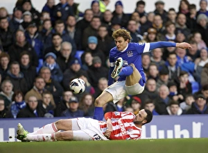 Everton 1 V Stoke City 0 : Goodison Park : 30-03-2013 Prints: Marc Wilson's Sliding Tackle on Nikica Jelavic: Everton's 1-0 Win Over Stoke City at Goodison Park (March 30)