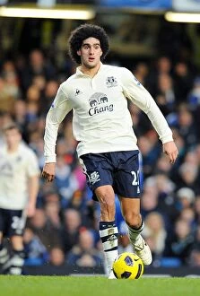 Images Dated 9th December 2010: Marouane Fellaini: Everton's Unstoppable Midfield Powerhouse