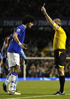 Images Dated 7th December 2008: Marouane Fellaini Yellow Carded by Martin Atkinson in Everton vs