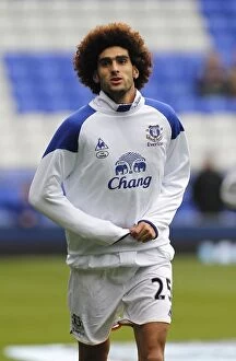 Images Dated 29th October 2011: Marouane Fellaini's Focused Pre-Match Routine: Everton Star Gears Up vs