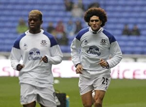 Images Dated 26th November 2011: Marouane Fellaini's Intense Focus: Everton Star's Pre-Game Warm-Up at Reebok Stadium