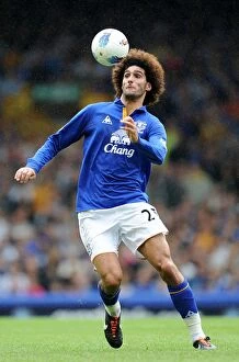 Images Dated 20th August 2011: Marouane Fellaini's Thunderous Performance: Everton's Unforgettable Victory Over QPR (BPL 2011)