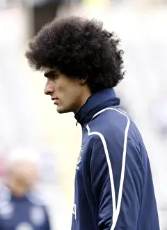 Newcastle V Everton Prints: Marouane Fellaini's Unwavering Focus: Everton Star's Pre-Match Ritual at St