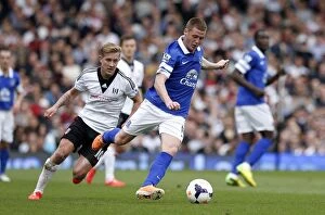 Images Dated 30th March 2014: McCarthy vs. Holtby: Everton's Victory Over Fulham in the Barclays Premier League (30-03-2014)