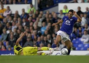 Images Dated 24th August 2011: Mikel Arteta Foul by Richard Cresswell: Everton vs Sheffield United (Carling Cup 2011)
