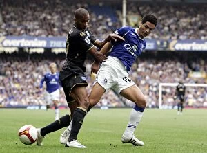 Everton v Portsmouth Collection: Mikel Arteta vs Armand Traore: Intense Clash in Everton vs Portsmouth Barclays Premier League Match