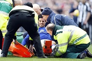 Images Dated 22nd February 2009: Mikel Arteta's Injury: Everton Star Carried Off in Pain during Newcastle United vs. Everton, 2009