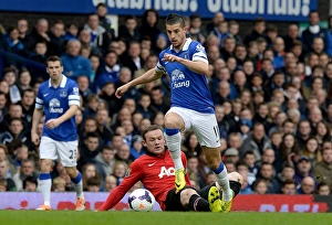 Everton 2 V Manchester United 0 : Goodison Park : 21-04-2014 Prints: Mirallas Outmaneuvers Rooney: Everton's Triumph Over Manchester United in the Premier League (April 21)