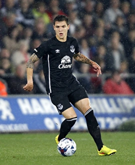 Full Length Prints: Muhamed Besic in Action: Everton vs Swansea City - Capital One Cup Third Round