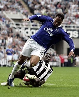 Images Dated 24th September 2006: Newcastles Obafemi Martins tackles Evertons Joleon Lescott