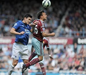 West Ham United v Everton - Upton Park Collection: Noble vs. Barry: A Battle of Midfield Masters in the Barclays Premier League - West Ham United vs