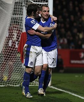 Images Dated 7th January 2013: Osman and Baines: Everton's Triumphant Goal Celebration in FA Cup Victory over Cheltenham Town