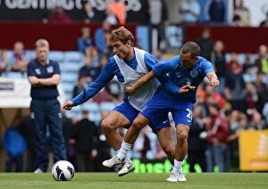 Images Dated 25th August 2012: Osman and Jelavic Go Head-to-Head: Intense Warm-Up Before Aston Villa vs Everton (25-08-2012)