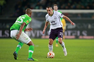Framed Print : Osman vs. Naldo: A UEFA Europa League Battle - Everton vs. VfL Wolfsburg Framed Print : Osman vs. Naldo: A UEFA Europa League Battle - Everton vs. VfL Wolfsburg