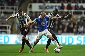 Images Dated 25th March 2014: Osman's Triumph: Everton's Dominant 3-0 Victory Over Newcastle United - Osman's Battles with Dummett