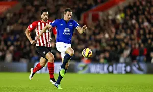 Southampton V Everton - St Mary's Prints: Pelle vs Jagielka: A Battle of Strength and Determination in Everton vs Southampton's Premier League Clash