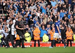 Images Dated 27th September 2014: Phil Jagielka Greets Liverpool Fans Amidst Intense Anfield Rivalry (BPL: Everton vs. Liverpool)