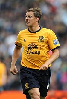 Images Dated 14th May 2011: Phil Jagielka Leads Everton in Intense BPL Clash vs. West Bromwich Albion (14 May 2011)