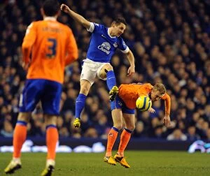 FA Cup : Round 5 Replay : Everton 3 v Oldham Athletic 1 : Goodison Park : 26-02-2013 Collection: Phil Jagielka vs. Dean Furman: FA Cup Battle at Goodison Park