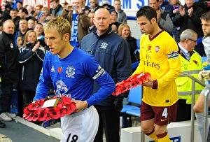 Images Dated 14th November 2010: Phil Neville and Cesc Fabregas Lead Out Poppy Wreaths: Everton vs