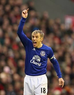 Images Dated 16th January 2011: Phil Neville Faces Off: Liverpool vs. Everton, Barclays Premier League Rivalry (16 January 2011)
