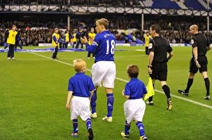 Images Dated 26th October 2011: Phil Neville Greets Fans and Leads Mascots: Everton vs. Chelsea