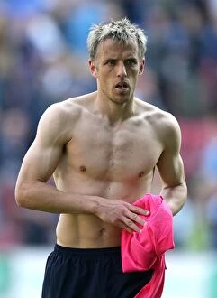 Images Dated 30th April 2011: Phil Neville Leads Everton at DW Stadium Against Wigan Athletic in Barclays Premier League