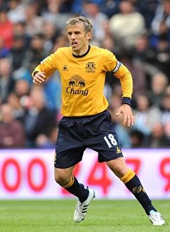 Images Dated 14th May 2011: Phil Neville Leads Everton at The Hawthorns in Intense BPL Clash vs