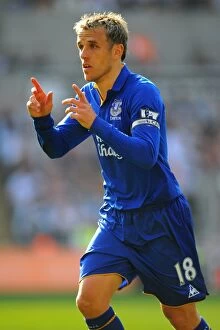 24 March 2012 v Swansea City, Liberty Stadium Collection: Phil Neville Leads Everton at Swansea City's Liberty Stadium in Barclays Premier League