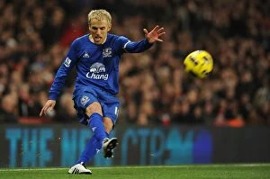 Images Dated 2nd February 2011: Phil Neville vs. Arsenal: Everton's Fierce Face-Off at Emirates Stadium (01 February 2011)