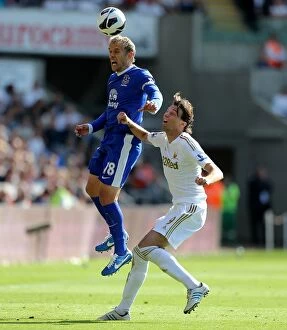 Images Dated 22nd September 2012: Phil Neville vs Miguel Michu: Everton's 3-0 Victory over Swansea City (Barclays Premier League)