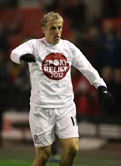 13 March 2012 V Liverpool, Anfield Prints: Phil Neville's Intense Face-Off at Anfield: Liverpool vs
