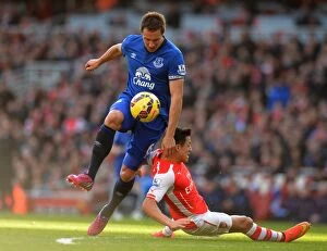 Arsenal v Everton - Emirates Stadium Collection: Premier League: Jagielka Tackles Sanchez in Intense Arsenal vs. Everton Clash