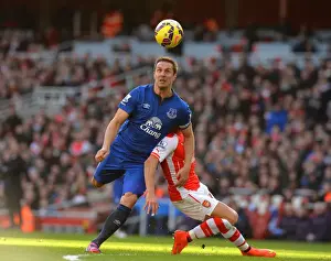Framed Print : Premier League: Phil Jagielka Tackles Alexis Sanchez of Arsenal during Everton vs Arsenal Match Framed Print : Premier League: Phil Jagielka Tackles Alexis Sanchez of Arsenal during Everton vs Arsenal Match