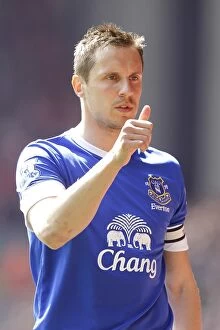 Images Dated 5th May 2013: Rivalry Unyielding: A 0-0 Battle Between Liverpool and Everton at Anfield - Phil Jagielka's