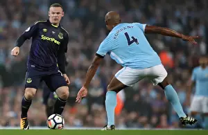 Rooney vs. Kompany: Intense Battle for Ball at Etihad Stadium - Manchester City vs. Everton, Premier League