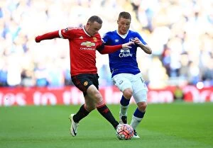 Images Dated 23rd April 2016: Rooney vs McCarthy: A Football Rivalry Unfolds in the Emirates FA Cup Semi-Final at Wembley