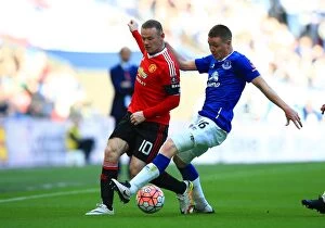 Images Dated 23rd April 2016: Rooney vs McCarthy: An Intense Battle - Everton vs Manchester United FA Cup Semi-Final at Wembley