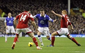 Everton 4 v Fulham 1 : Goodison Park : 14-12-2013 Collection: Ross Barkley's Determined Clash with Fulham Defenders in Everton's 4-1 Premier League Triumph at