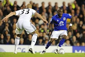 Images Dated 26th October 2011: Royston Drenthe Charges Forward Against Chelsea: Everton's Drenthe Takes On Alex in Carling Cup