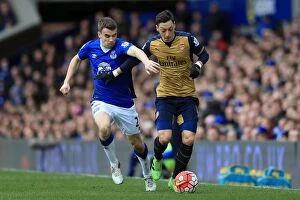 Images Dated 19th March 2016: Seamus Coleman vs. Mesut Ozil: A Battle for the Ball at Goodison Park - Everton vs