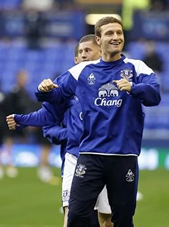 Images Dated 19th November 2011: Shkodran Mustafi Leads Everton's Warm-Up Ahead of Premier League Showdown vs