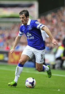 Season 2013-14 Prints: A Stalemate at Cardiff City Stadium: Leighton Baines and Everton Secure a 0-0 Draw in the Barclays Premier League