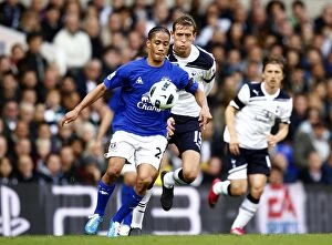Images Dated 23rd October 2010: Steven Pienaar Beats Peter Crouch: Everton's Thrilling Victory Over Tottenham Hotspur in Barclays