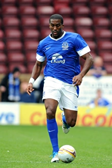 Season 2012-13 Prints: Sylvain Distin Leads Everton in Pre-Season Friendly at Fir Park Stadium