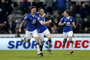 Newcastle United v Everton - Barclays Premier League - St James' Park Collection: Thrilling Moment: Cleverly and Besic's Euphoric Goal Celebration - Everton's First at St James' Park