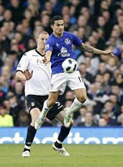 Images Dated 19th March 2011: Tim Cahill Shields Ball from Hangeland: Everton's Defensive Masterclass vs