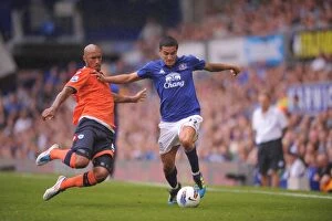 Images Dated 20th August 2011: Tim Cahill vs. Fitz Hall: A Battle at Goodison Park (2011) - Everton vs