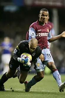Everton V Aston Villa Prints: Tim Howard vs Gabriel Agbonlahor: A Battle at Goodison Park
